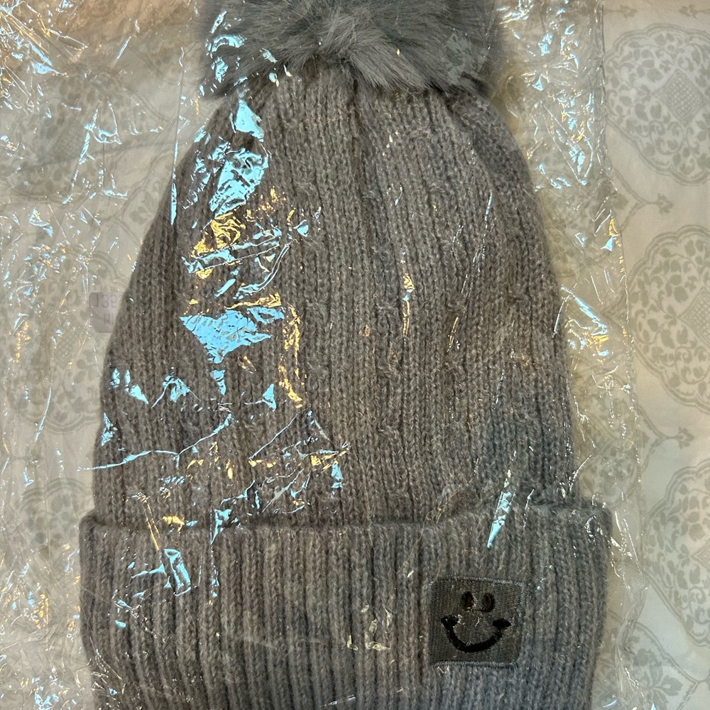Gray Knit Winter Hat with Pom Pom and Decorative Patch